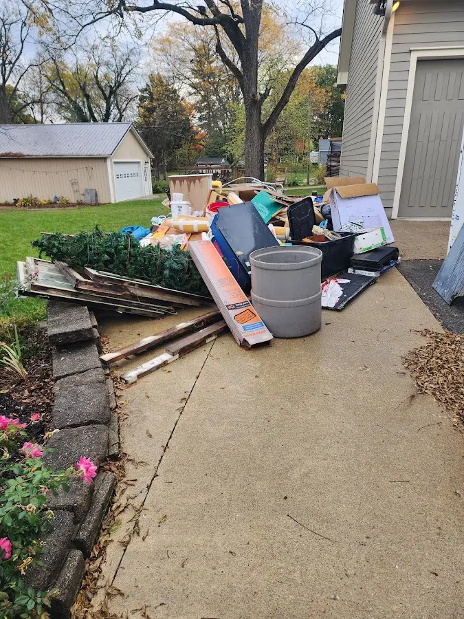 Dumpster being loaded with debris for Commercial Dumpster Rental in Dickinson